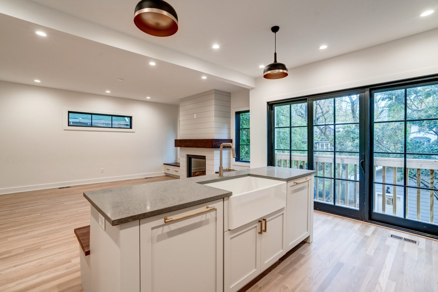 Remodeling professional installing custom cabinetry in a bright Galesburg, MI kitchen renovation