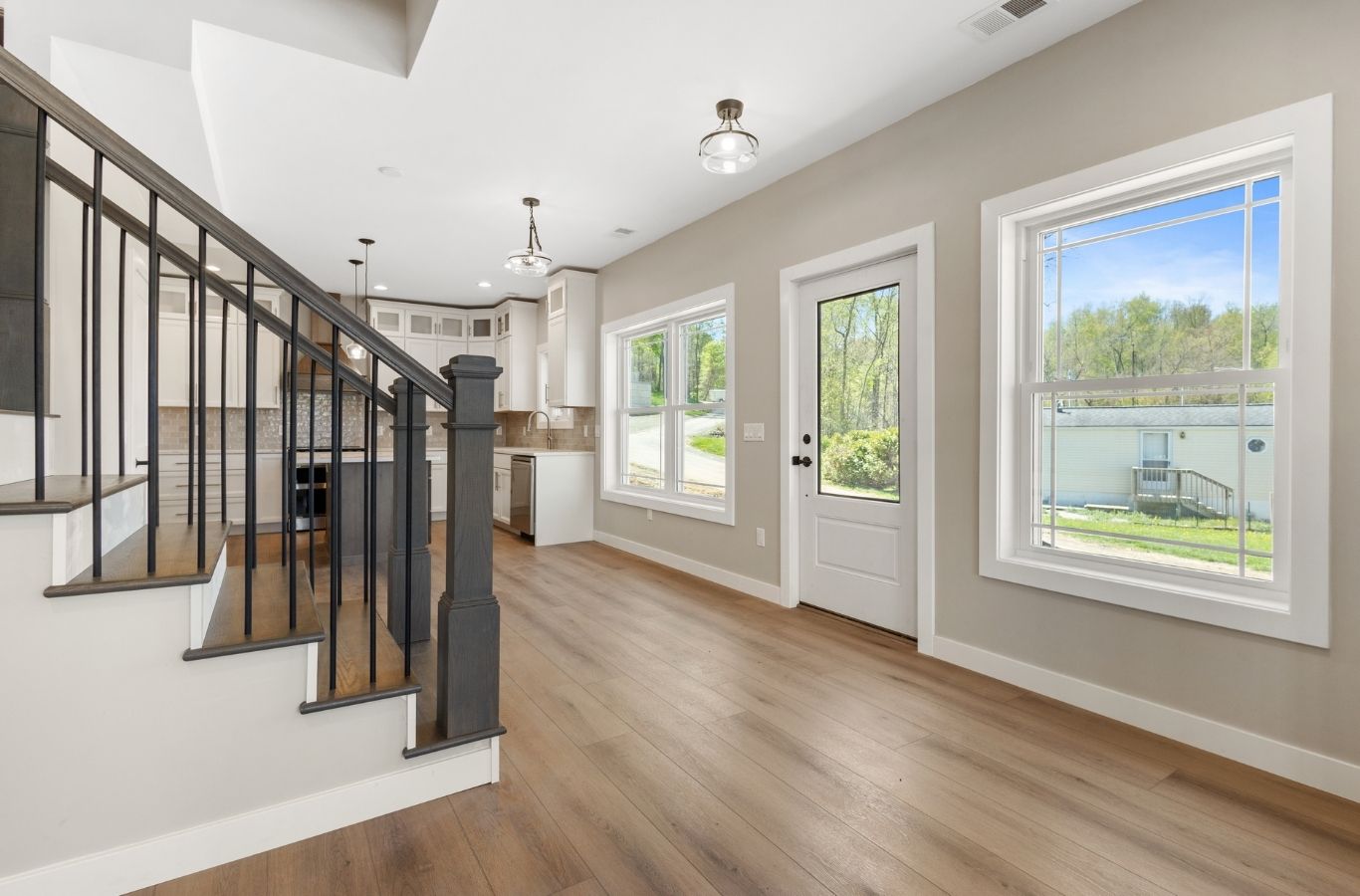 Skilled renovator installing energy-efficient windows in a Schoolcraft, MI living room