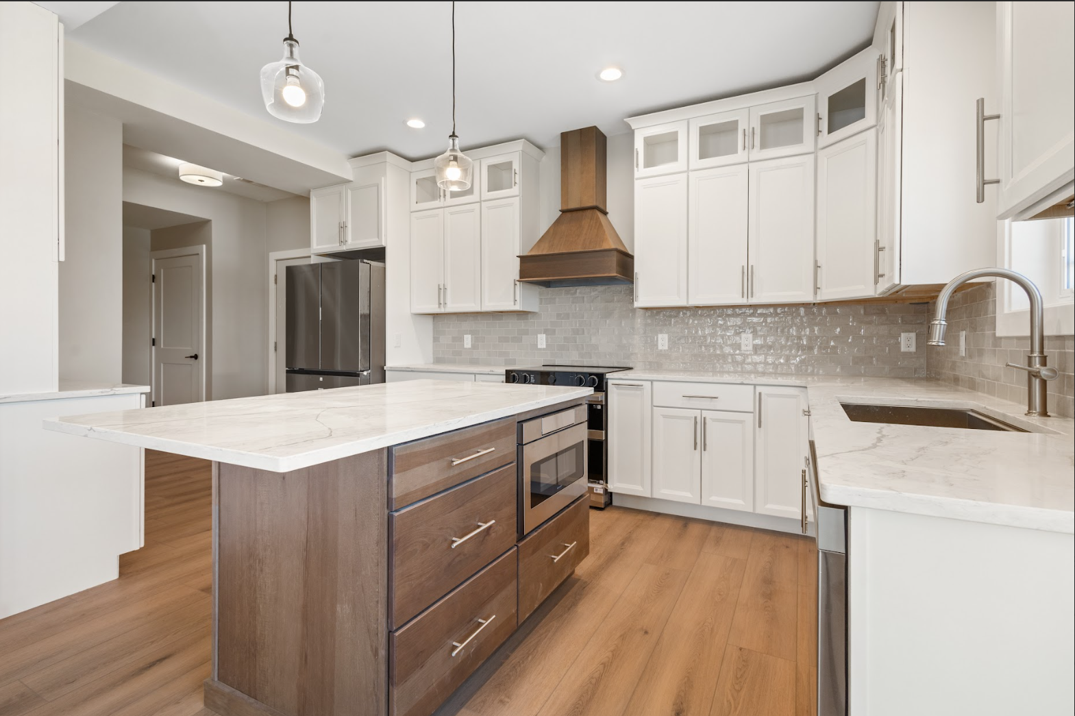 Expert craftsman from Character Interiors installing custom cabinetry during Home Remodeling in a Texas Township, MI residence