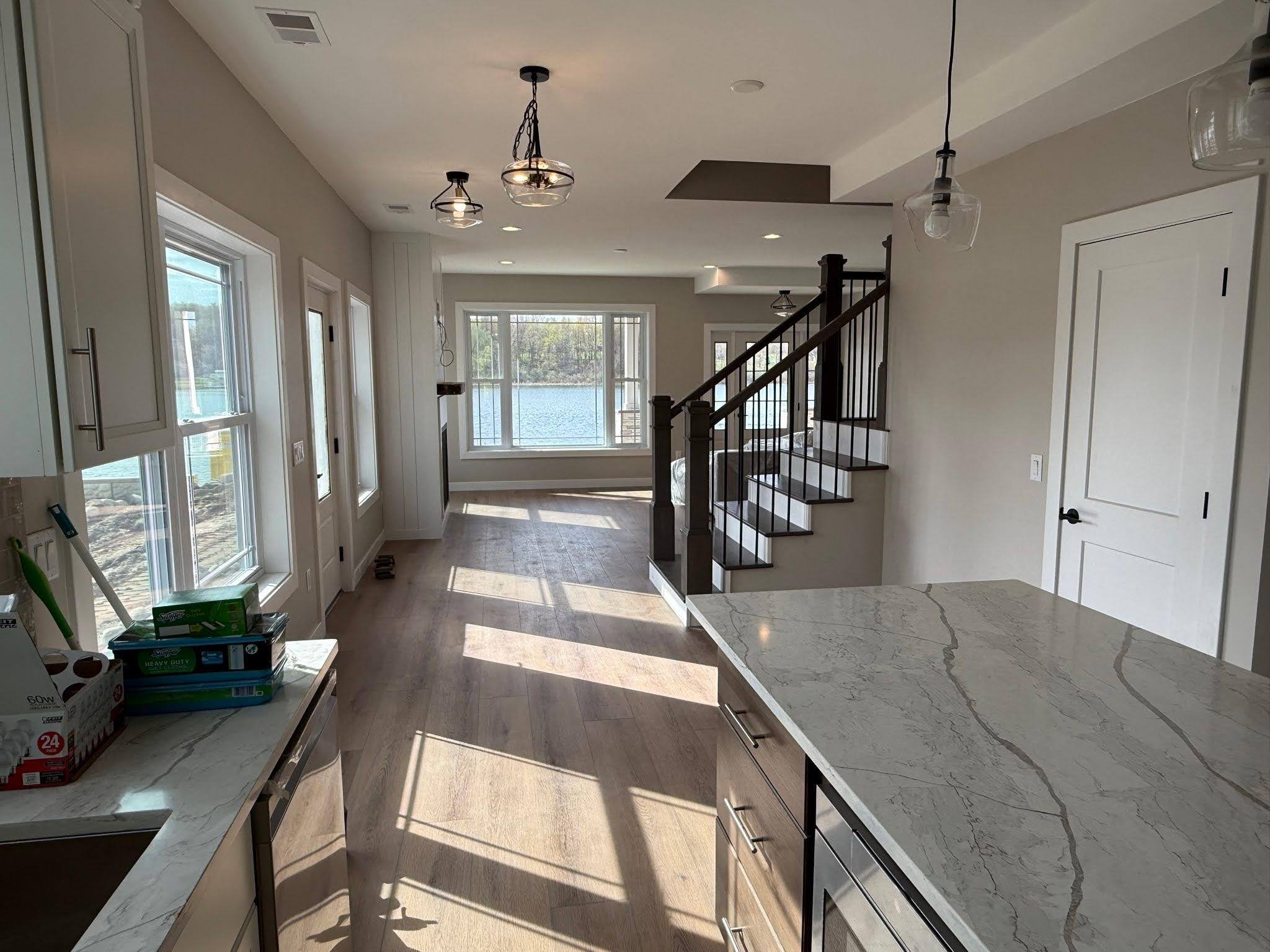 Creative team at Character Interiors discussing innovative design plans for Expert Home Remodeling in a Texas Township, MI home