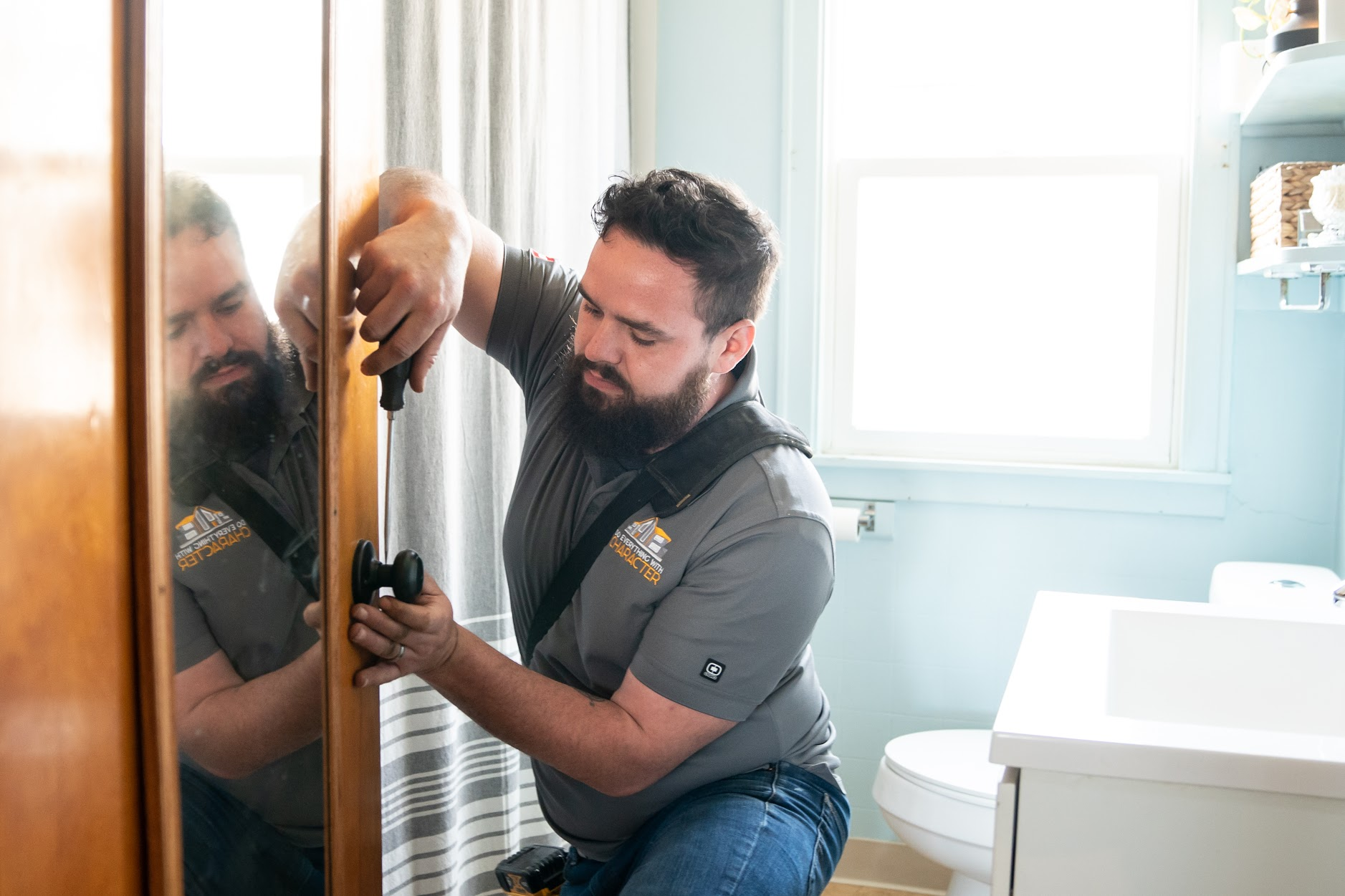 Expert contractor installing bathroom fixtures during a remodel in Vicksburg, MI